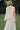 Petite Studio's Didi Cowl Neck Flared Top in Cream
