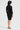 Woman wearing a black dress on a white background