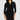 Woman wearing a black wrap dress against a white background