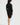 Woman wearing a black dress on a white background