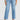 Person wearing light blue jeans on a white background